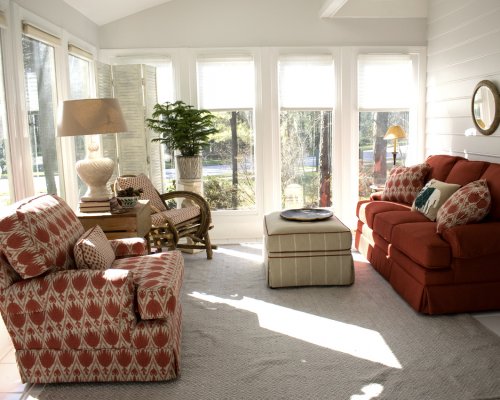 Sun Room Rust Couch Striped Ottoman Sunlit Windows Sun Room Rust Couch Striped Ottoman Sunlit Windows